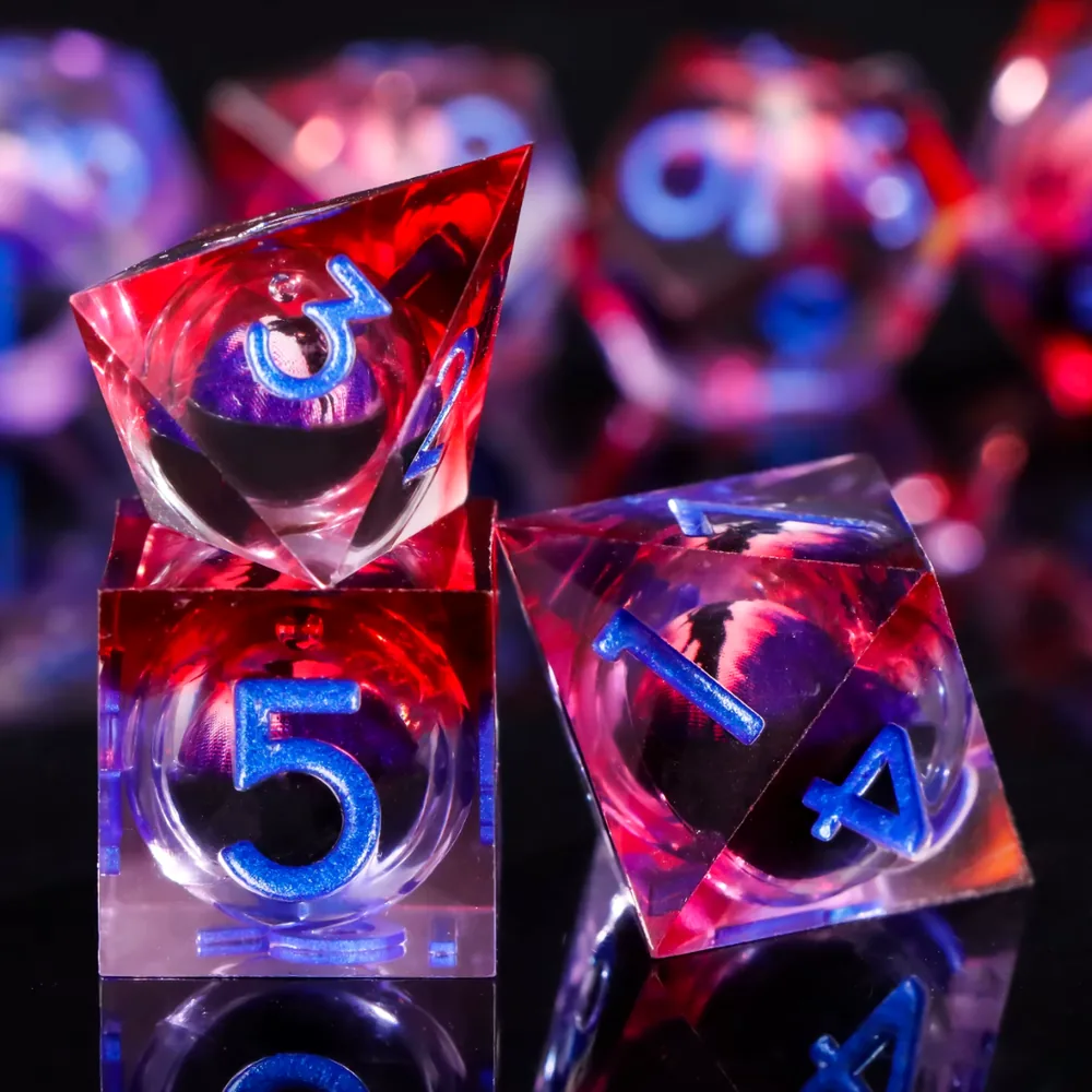 Close-up of a Bloodmoon d8 and d6 with the eye visible through the resin
